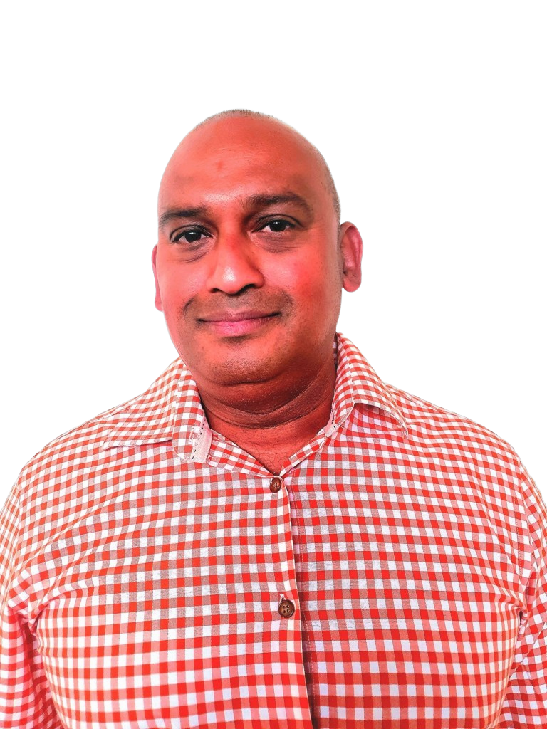 Edit this staff headshot of Shadrach Sumaru so that only the background area behind his face and torso is replaced with a clean, blank solid white, matching the current background appearance of the other team photos on the page, while keeping his face, body, clothing, original crop, subject lighting, and image quality unchanged.